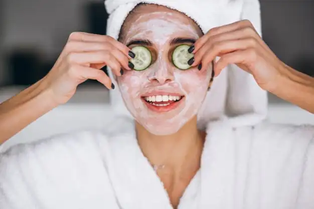 a woman doing facial mask